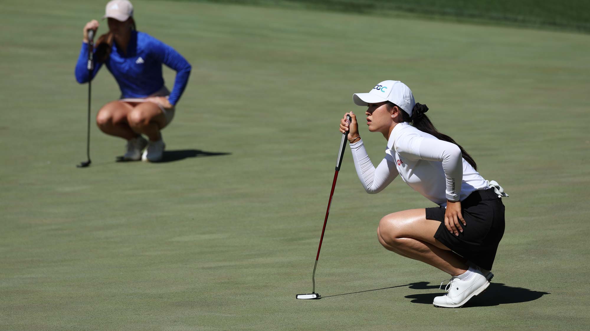 Pajaree Anannarukarn of Thailand and Linn Grant of Sweden line up putts on the eighth green on day five of the Bank of Hope LPGA Match-Play presented by MGM Rewards